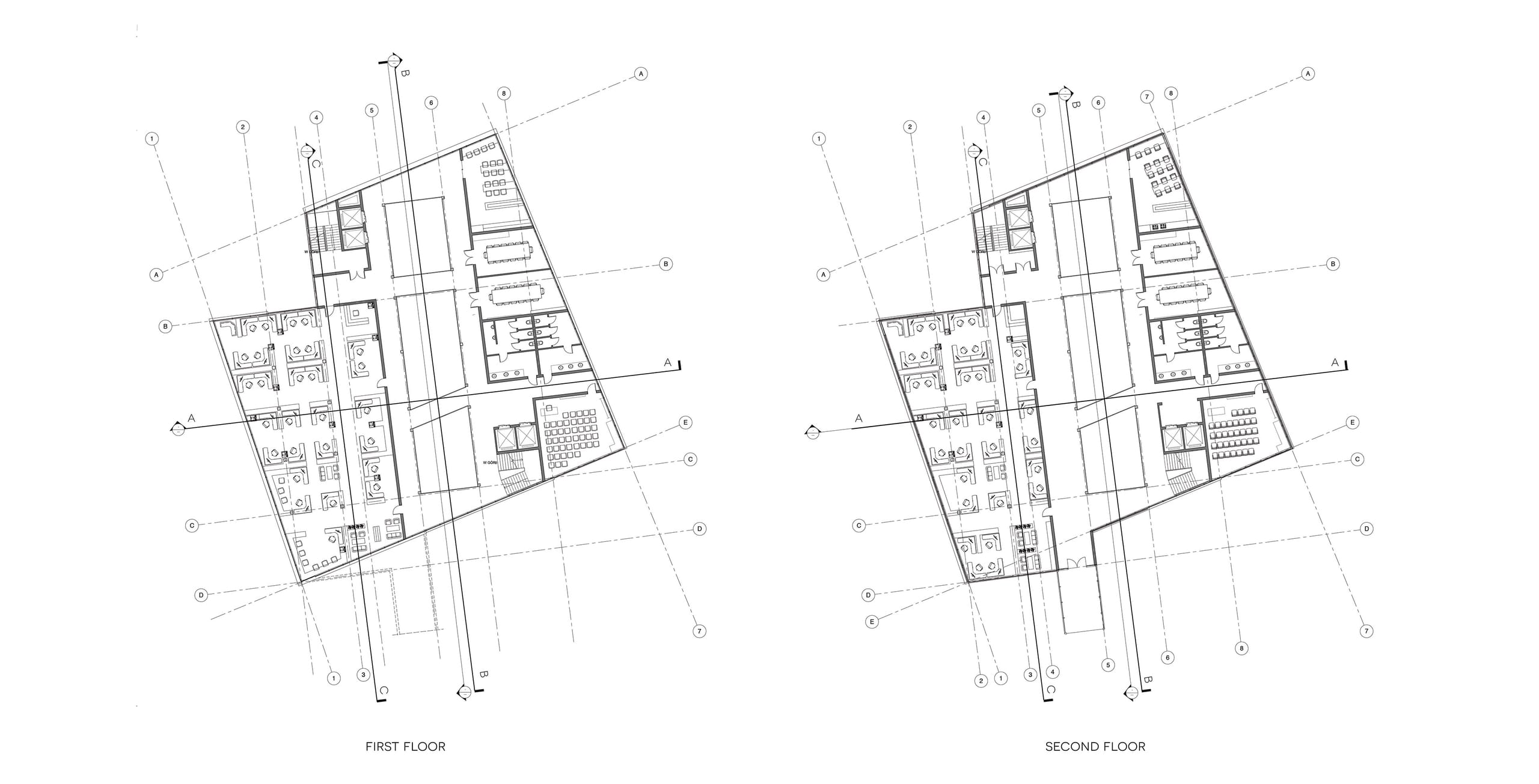 Architectural floor plans of the first and second floors showing office desks, corridors and stair cores