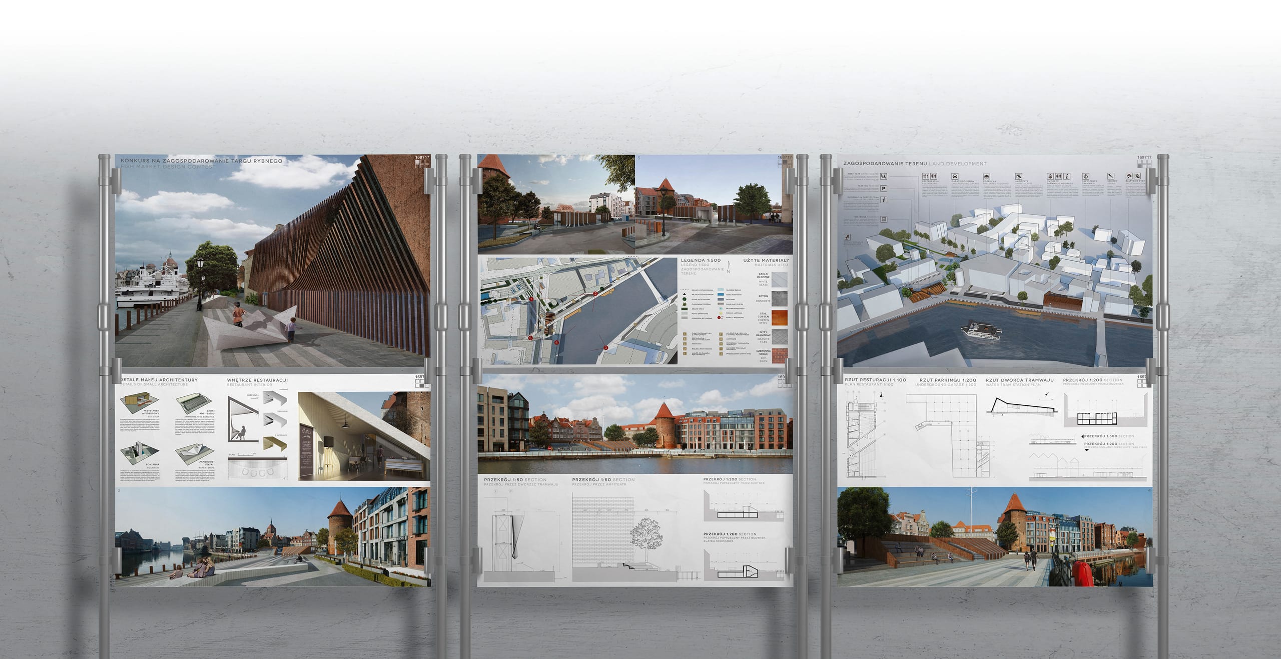Three competition presentation boards on display stands showing renders, plans and sections of the project
