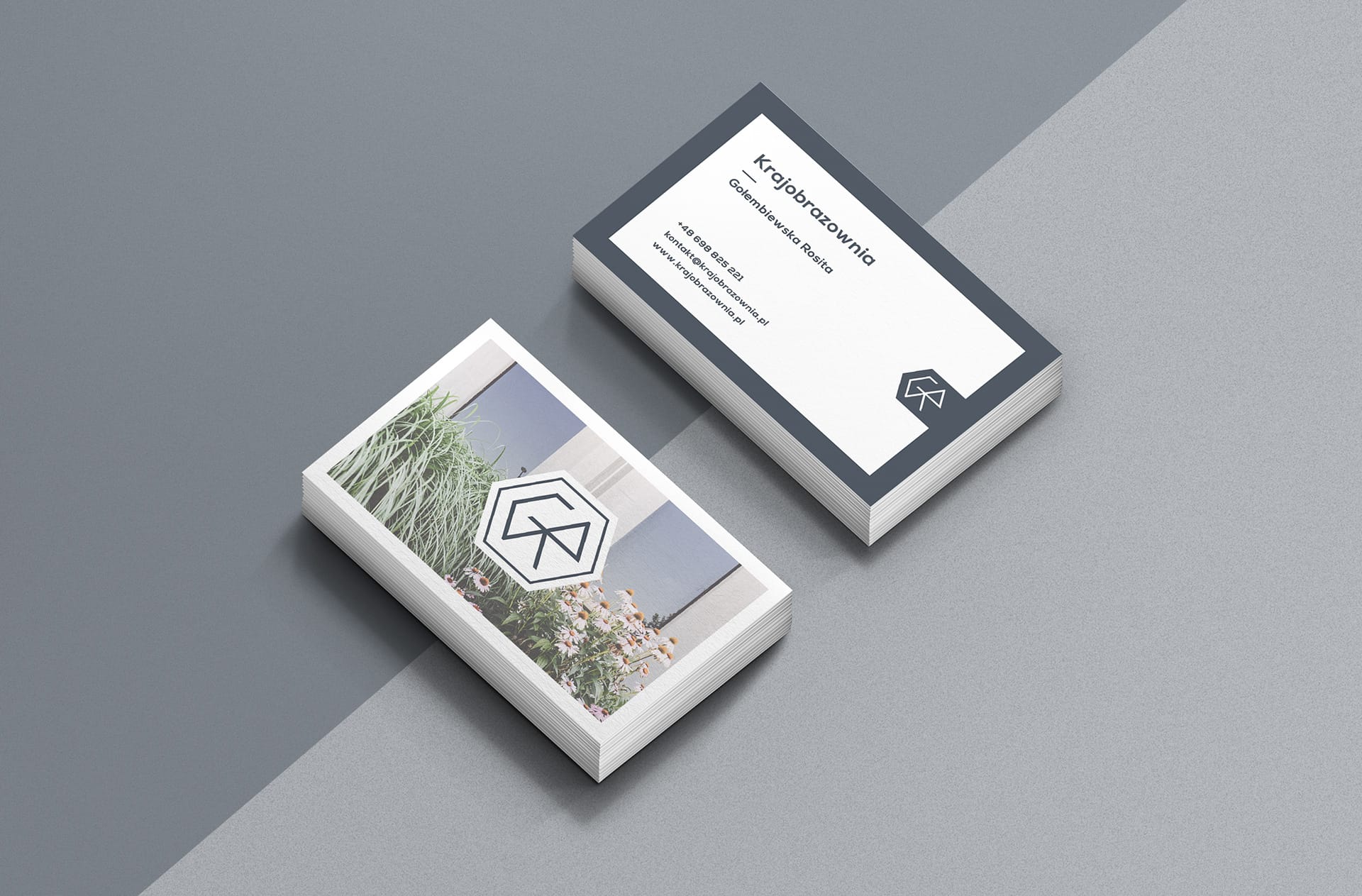 Two business-card stacks: a photo side with logo over grasses and flowers, and a text side with name and contact details