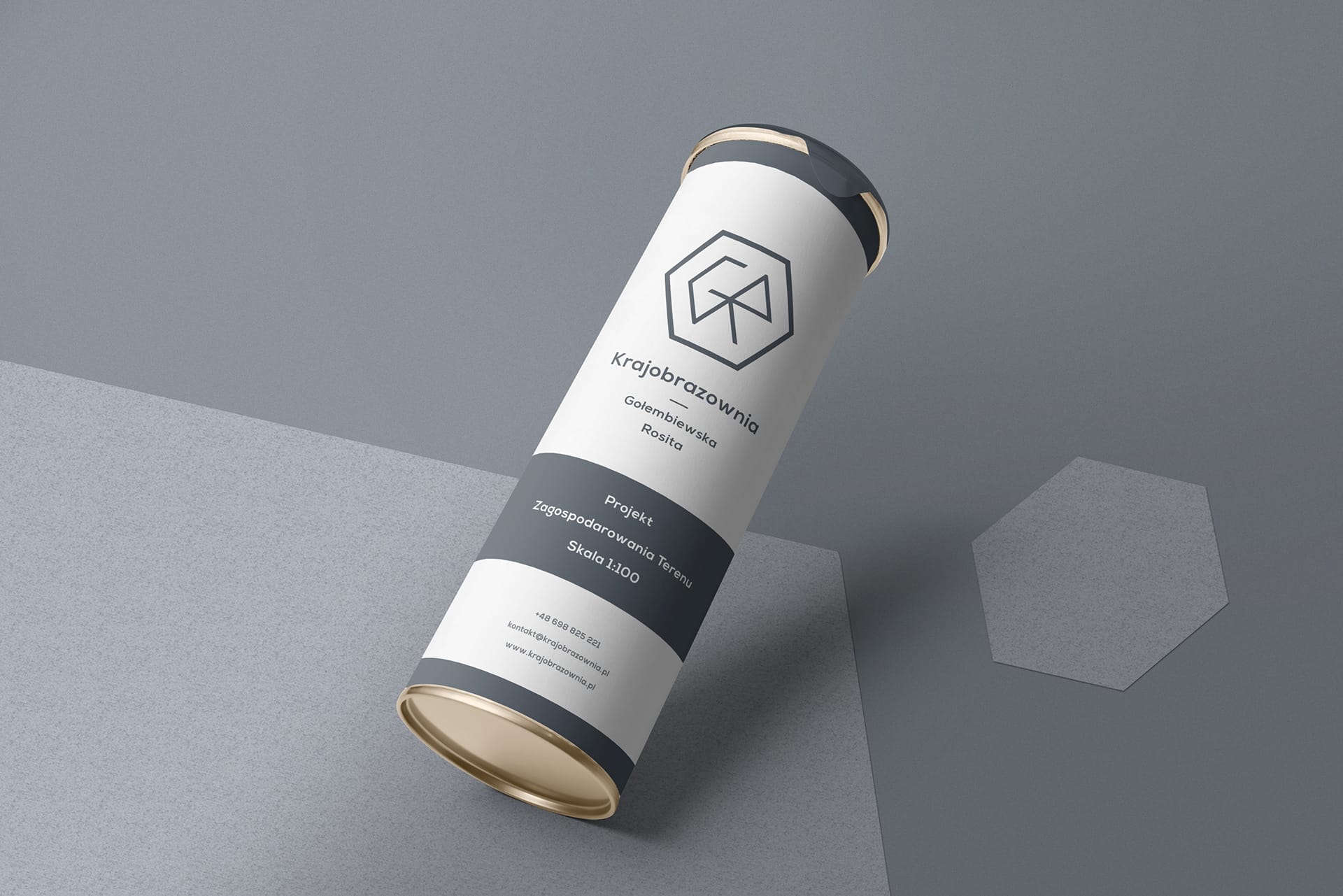 Branded cardboard mailing tube with the CR hexagon logo and project label for a scale 1:100 landscape plan