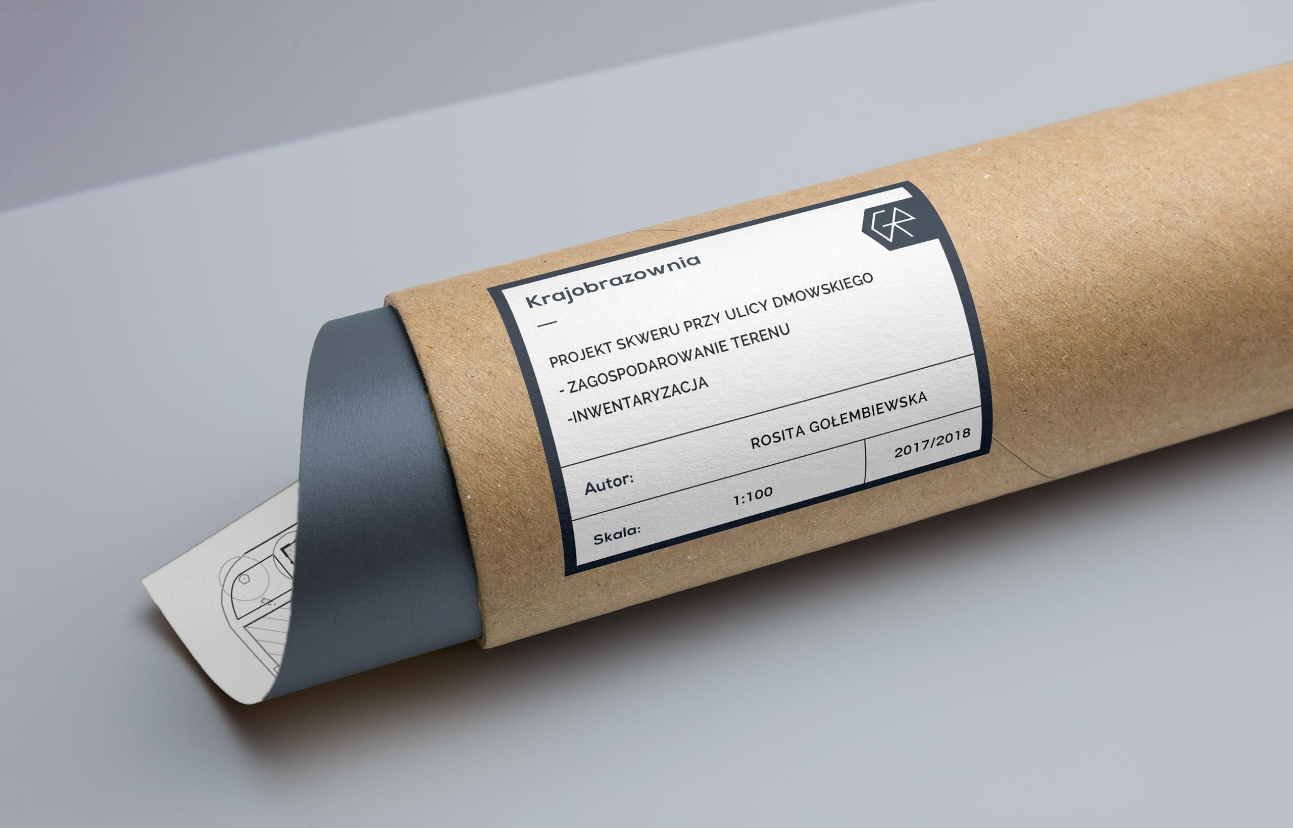 Kraft postal tube with a branded project label and CR logo, a rolled landscape drawing emerging from one end
