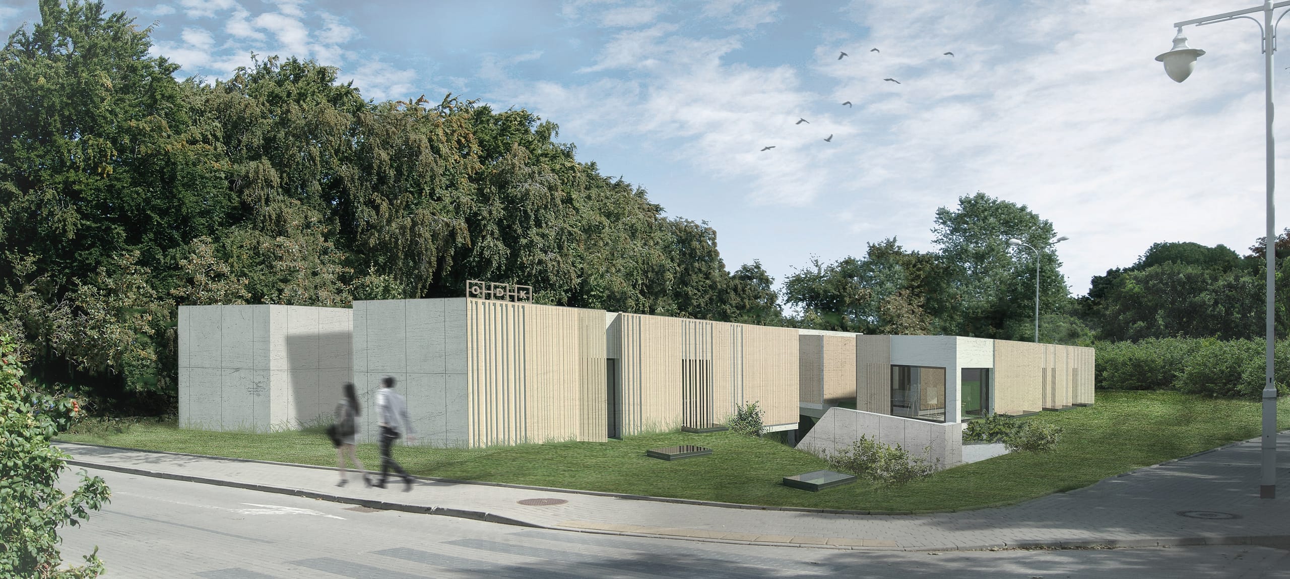Street-level render of the low-slung ODK centre in wood slats and white plaster, ODK sign on the facade, with two pedestrians walking past